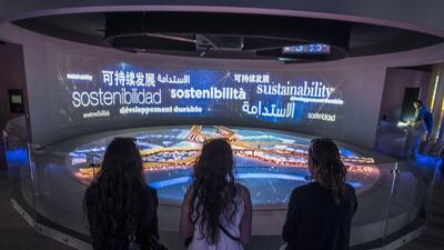 Visitor watch a virtual presentation at the UAE pavilion. Giuseppe Aresu / The National