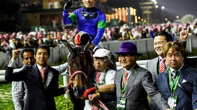 Panthalassa's jockey Yutaka Yoshida, trainer Yoshito Yahagi and connections react after winning the $20 million G1 Saudi Cup over 1800m at the King Abdulaziz racetrack in Riyadh, Saudi Arabia, Saturday, February 25, 2023. (AP Photo / Martin Dokoupil)