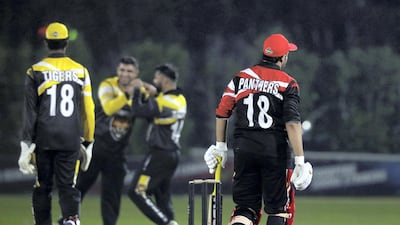 Tigers' Babar Iqbal takes the wicket of Panthers' Usman Mushtaq during the Karwan Rising Stars F40 Final. Chris Whiteoak / The National