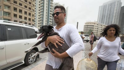 Residents save their pets from the burning Zen Tower. Leslie Pableo for The National