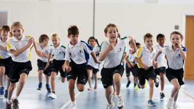 Year 3 pupils are pictured during physical education at the Brighton College Abu Dhabi. Brighton College is to expand into Dubai. Pawan Singh / The National