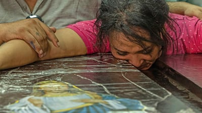 Funerals were held at two Cairo churches after a blaze ripped through the Coptic Christian church during Sunday Mass. AFP