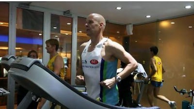 Terry Hislop, centre, trains at a simulated high altitude at the gym in the Mina a'Salam hotel in Madinat Jumeirah.