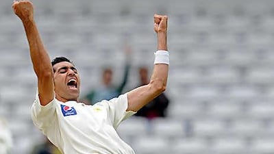 Pakistan's Umar Gul captures the wicket of Australia's Michael Hussey during the first day of the second Test at Headingley.