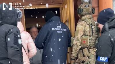 A handout photo made available by the Economy Security Bureau of Ukraine shows detectives entering the house of Ukrainian business tycoon Ihor Kolomoisky (3L) in Dnipro, Ukraine, 01 February 2023. EPA / Economy of Security Bureau of Ukraine