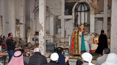 Syriac Orthodox Patriarch of Antioch, Ignatius Aphrem II, gives a sermon during mass at the heavily damaged Syriac Orthodox church of St Mary in Syria's eastern city of Deir Ezzor. AFP