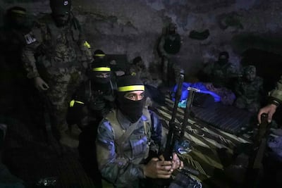 Fighters from Hayat Tahrir gather in Atarib, in the northern Syrian province of Aleppo. AFP