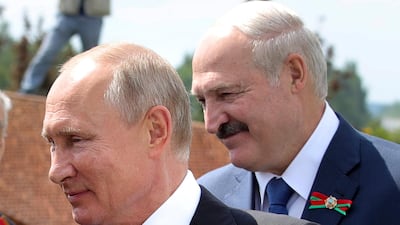 Russian President Vladimir Putin, left, and Belarusian President Alexander Lukashenko greet WWII veterans in June. AP