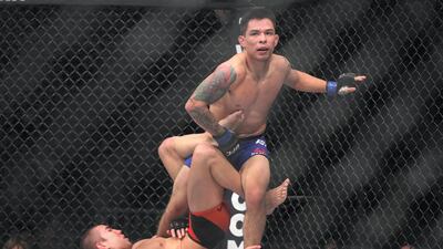 Ray Borg (standing) in action at UFC 207 on December 30, 2016 in Las Vegas, Nevada. AFP