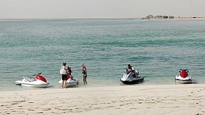 The map outlines zones across Abu Dhabi Island and beyond where powered vessels, such as boats, and powered water craft, such as jet skis, are prohibited.