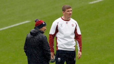 England coach Eddie Jones, left, speaks with Owen Farrell during a training session. AP