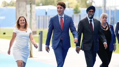 Canada's prime minister Justin Trudeau arrives with foreign minister Chrystia Freeland and defence minister Harjit Sajjan. Reuters