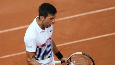 Novak Djokovic celebrates his five-set victory over Diego Schwartzman. Lionel Bonaventure / AFP