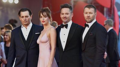 From left, Johnny Depp, Dakota Johnson, Scott Cooper and Joel Edgerton at the premiere of Black Mass in Venice. Ettore Ferrari / EPA