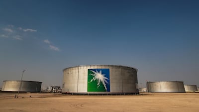 Saudi Aramco-branded oil tanks at its facility in Abqaiq. The company attracted 100 new investors through its first US dollar-denominated sukuk, which raised $6bn. Reuters