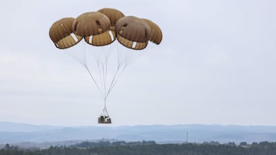 Military equipment is parachuted from a A400M aircraft during military drill 'Orion' in Castres, France. AFP