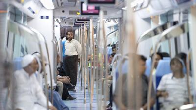 People ride the train of the Dubai Metro's Green Line. Jaime Puebla / The National