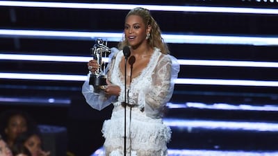 Beyoncé accepts an award on stage during the 2016 MTV Video Music Awards. Jewel Samad / AFP