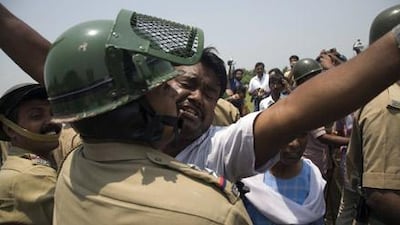 Farmers and villagers clash with West Bengal police after the forced confiscation of land intended to house a Tata Motors plant in 2007.