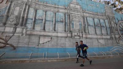 Egyptians are jogging near the compound of the military academy in Cairo, Egypt, 28 March 2020. EPA