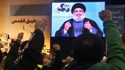 Hizbollah's Hassan Nasrallah speaks via video link in Beirut on February 16. Hussein Malla / AP Photo