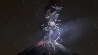 In this image released by World Press Photo titled “The Power of Nature” by photographer Sergio Tapiro which won the third prize in the Nature Singles category shows a powerful night explosion of the Colima Volcano with lightning, ballistic projectiles and incandescent rockfalls, Comala municipality in Colima, Mexico, 13 December 2015. Sergio Tapiro / World Press Photo via AP