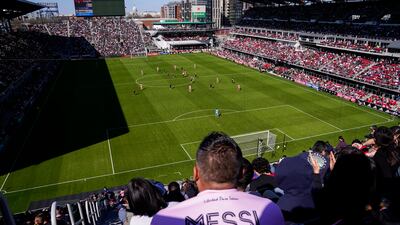 A fan wearing a Lionel Messi jersey watches the match at Audi Field. AP