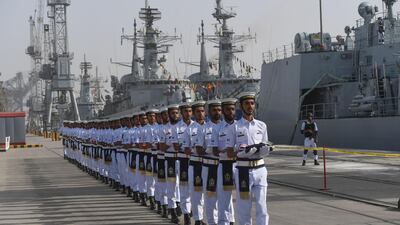 Pakistani Naval personnel march as they carry the flags of the countries participating in the navy's Multinational Exercise 'AMAN-19' in Karachi. Exercise Aman is scheduled from February 8-12. AFP