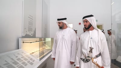 Sheikh Theyab bin Mohamed bin Zayed Al Nahyan, Chairman of the Department of Transport, and Abu Dhabi Executive Council Member, left; and Sheikh Zayed bin Hamad bin Hamdan Al Nahyan view a display in the Qasr Al Hosn exhibition and museum.