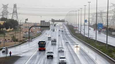 Traffic goes down the 611 as the rain comes down in Dubai. Chris Whiteoak / The National
