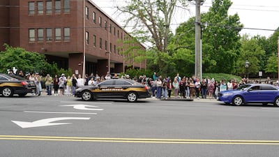 Police cars line the street outside the courthouse in Fairfax. Willy Lowry / The National