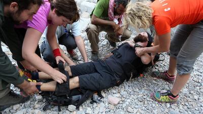 Instructor Chris Coyle demonstrates what to do if someone is hurt during an emergency training. Pawan Singh / The National