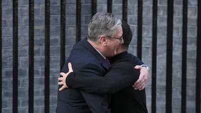 Britain's Keir Starmer embraces Ukraine's Volodymyr Zelenskyy in Downing Street, London, on Saturday. AP