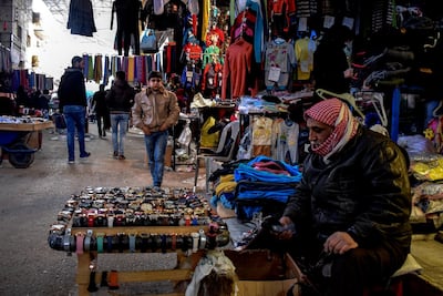 Syrian throng a popular market during New Year's eve in Manbij. EPA