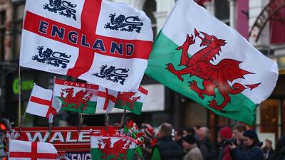 Flags of the opposing nations fly ahead of the Six Nations match between England and Wales in Cardiff on Friday. Michael Steele / Getty Images