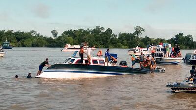Rescuers work at the site of where a ferry carrying some 45 people capsized at Tanjung Selor, North Kalimantan on January 1. At least eight people died and several others remain missing. Nurindra Wijaya / AFP
