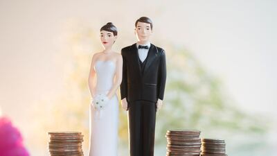 Partners should confide in each other about their financial situation, debts owed, spending habits, and goals for retirement or buying property, before they walk down the aisle. Photo: Getty Images