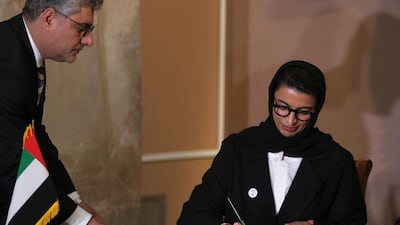 UAE Minister of Culture and Knowledge Development Noura Al Kaabi signs an agreement on the reconstruction of Mosul's Al Nuri mosque at the Iraqi National Museum in Baghdad on April 23, 2018. Ahmad Al Rubaye / AFP