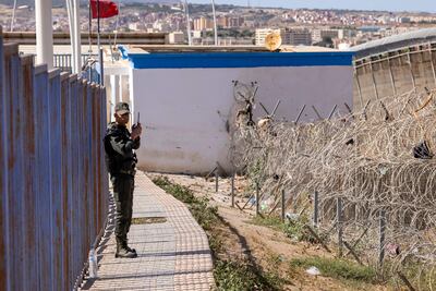 A Moroccan border guards patrols the heavily fortified boundary with Melilla. AFP
