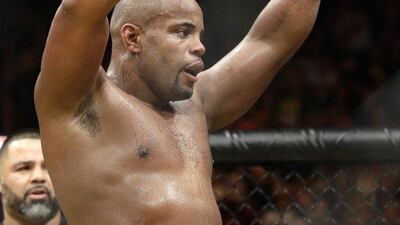 Daniel Cormier celebrates after defeating Anderson Silva during their light heavyweight bout at UFC 200, Saturday, July 9, 2016, in Las Vegas. John Locher / AP Photo