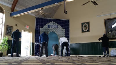 Worshippers perform dhuhr prayers inside the Masjid Muhammad in Washington on the first day of Ramadan. Willy Lowry / The National