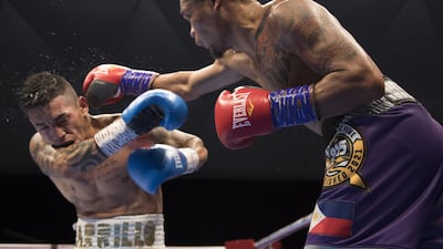 Donnie Nietes of the Philippines hitting Pablo Carillo of Colombia at the Rotunda, Ceasar's Palace, Bluewaters Island, Dubai. Leslie Pableo for The National