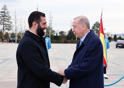 Turkish President Recep Tayyip Erdogan, right, receives Syria's interim President Ahmad Al Shara in Ankara in February. AFP