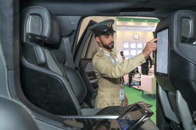Lt Saeed Mazroui uses a touchscreen system inside the 'Beast Patrol'. Victor Besa / The National