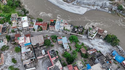 Debris and mud cover an area following flash floods in Devghat, Nepal. Getty Images