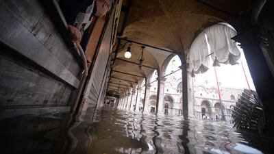 A man looks at floods in St Mark square in Venice. Filippo Monteforte / AFP
