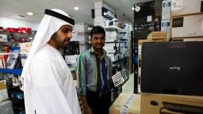National reporter Thamer Subaihi goes shopping in Bur Dubai’s electronics district last week dressed as an Emirati, left, and as an expatriate, next picture.