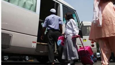 Children board the bus at the Pisco Private School in Abu Dhabi.