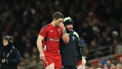 George North is led off the pitch during Wales' defeat to England on Friday. Simon Bellis / Sportimage