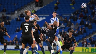 Brighton's English defender Adam Webster scores his team's second goal during the English Premier League football match between Brighton and Hove Albion and Manchester City at the American Express Community Stadium in Brighton, England. AFP